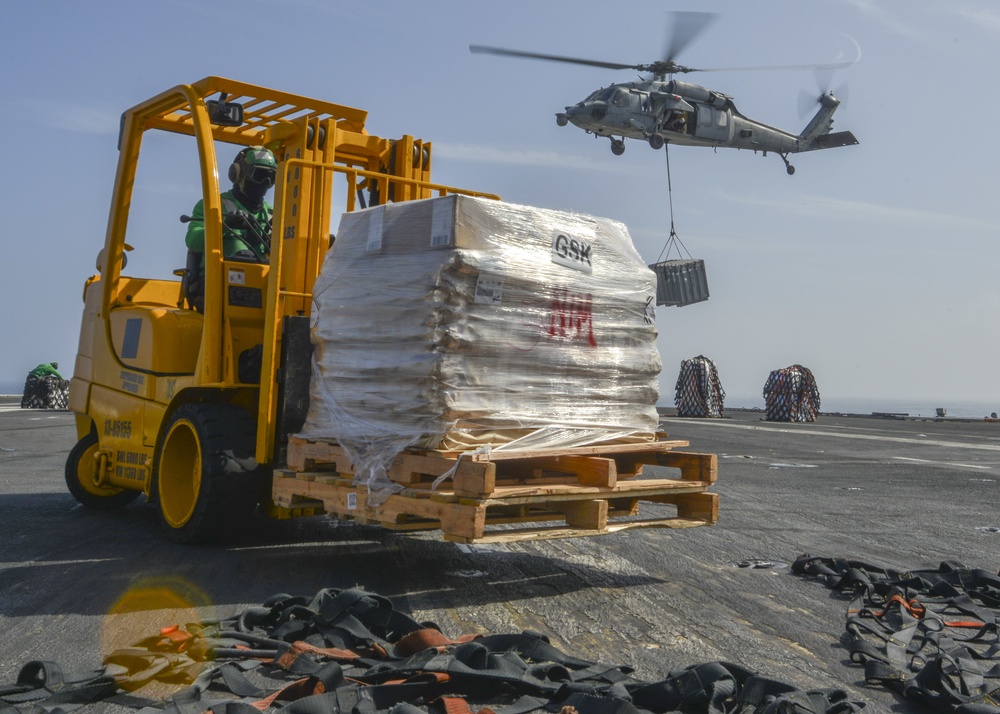 Logistics Specialst Transports Palets Vertical Replenishment-At-Sea On Flight Deck Aboard Aircraft Carrier USS Nimitz CVN 68