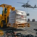 Logistics Specialst Transports Palets Vertical Replenishment-At-Sea On Flight Deck Aboard Aircraft Carrier USS Nimitz CVN 68