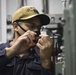 Electronics Technician Performs Radio Maintenance