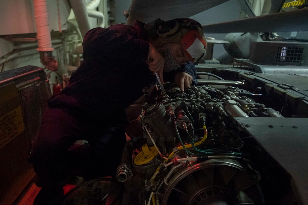 USS Ralph Johnson Sailors Conduct Helicopter Maintenance
