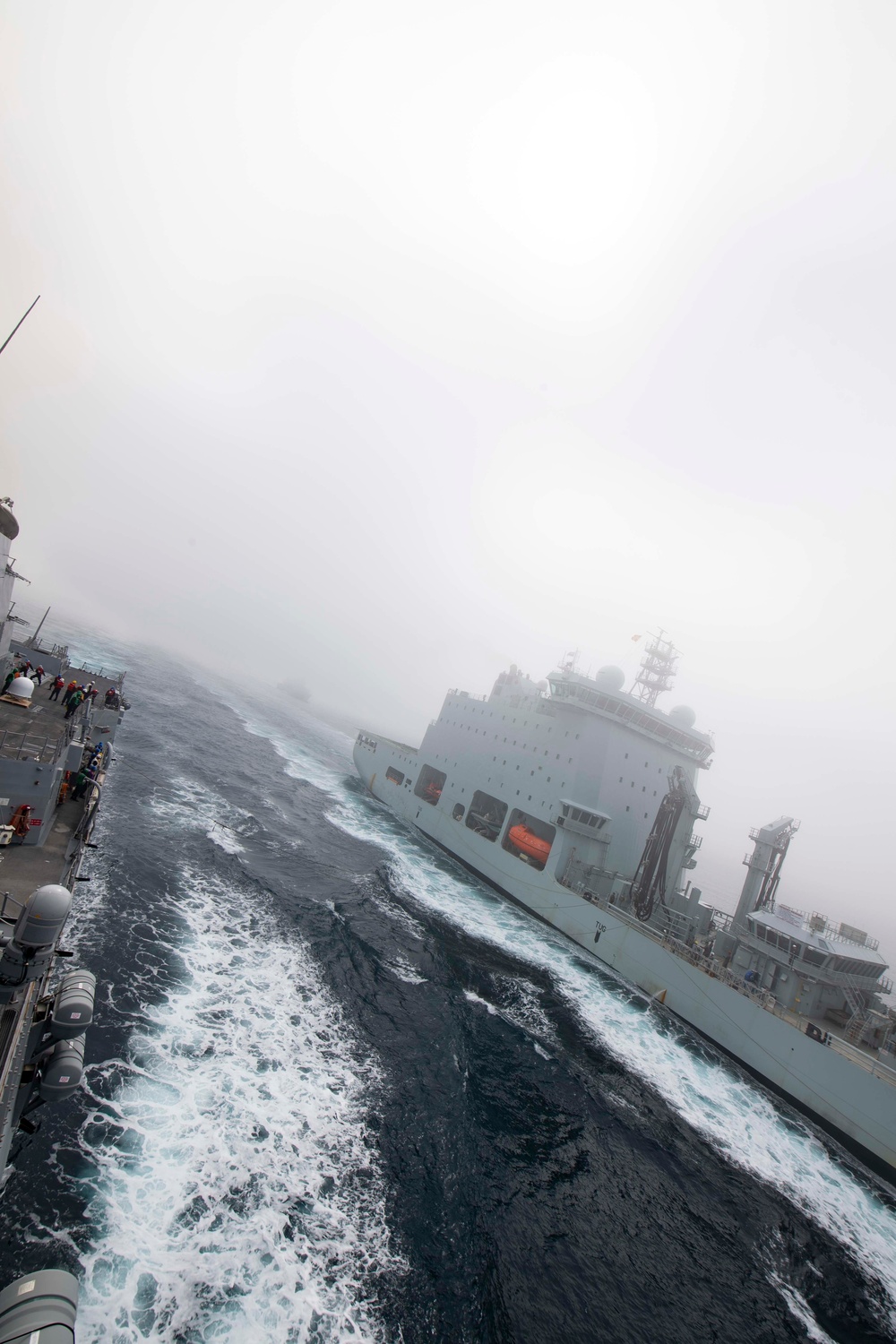 USS Thomas Hudner (DDG 116) Participates in a Replenishment-At-Sea With the Royal Canadian Ship MV Asterix.