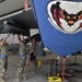 Weapons Airmen remove pylon for routine inspection