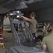 Weapons Airmen remove pylon for routine inspection