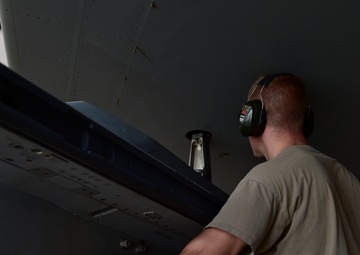 Weapons Airmen remove pylon for routine inspection