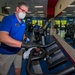 Fitness Center staff clean exercise equipment