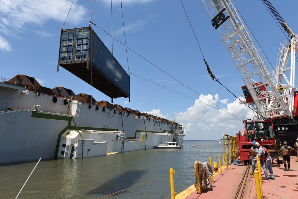 Crane places a modified shipping container around the motor vessel Golden Ray in St. Simons Sound
