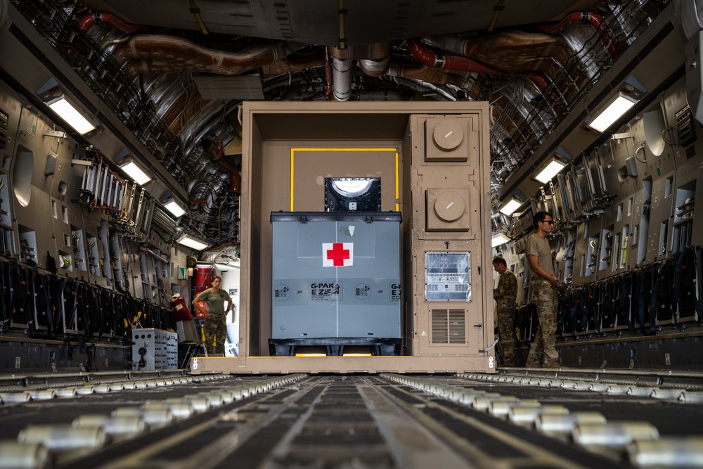 8th EAMS members offload NPC-Lite from C-17 Globemaster III