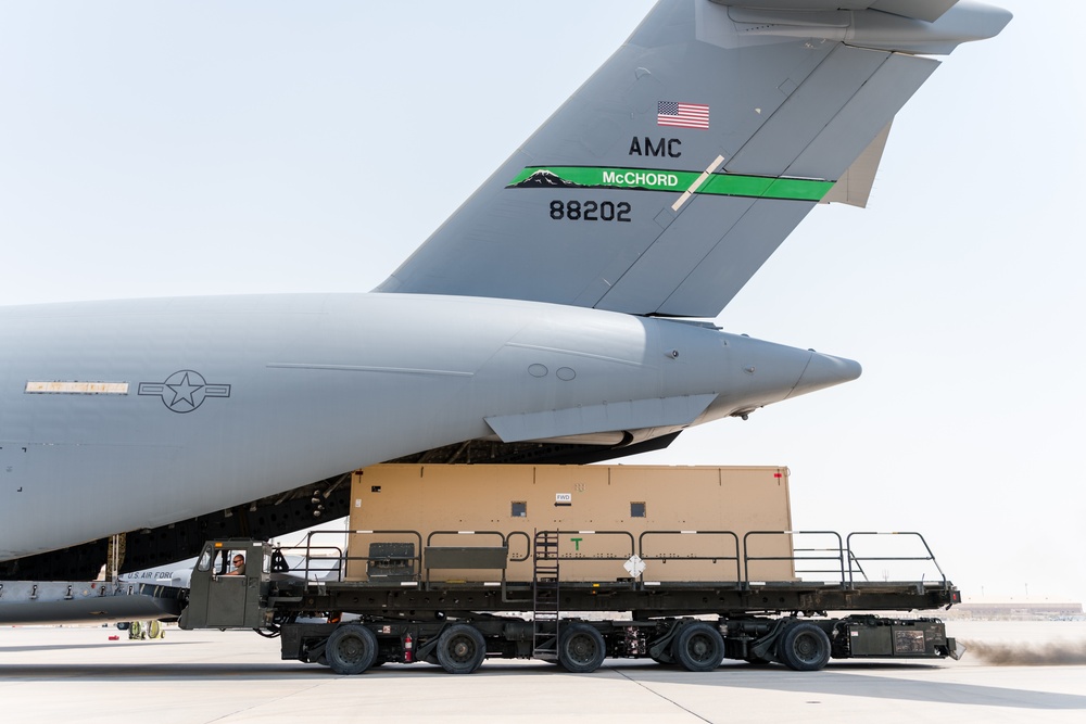 8th EAMS members offload NPC-Lite from C-17 Globemaster III