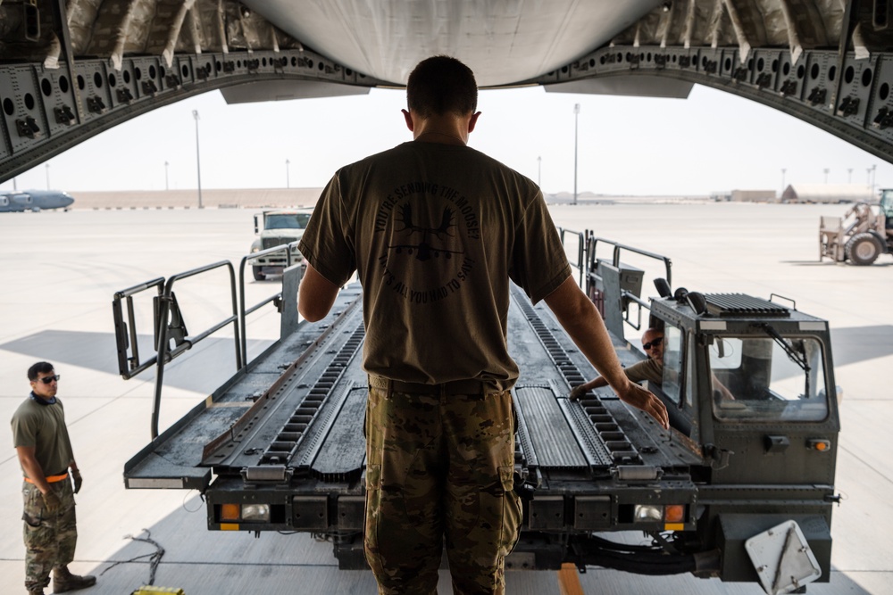 8th EAMS members offload NPC-Lite from C-17 Globemaster III