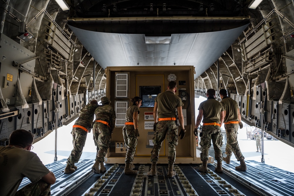 8th EAMS members offload NPC-Lite from C-17 Globemaster III