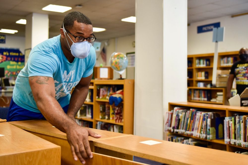 Volunteers Onboard NSA Naples Prepare Schools for Physical Distancing