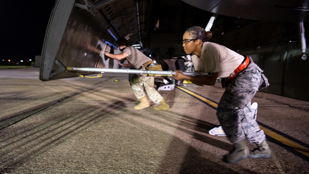 96th AMU Airmen load Navy mines as part of training exercise