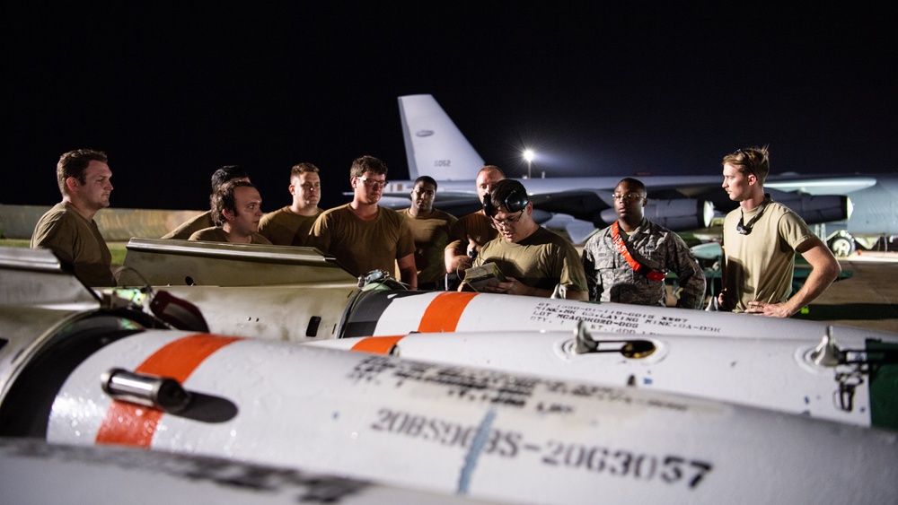 96th AMU Airmen load Navy mines as part of training exercise