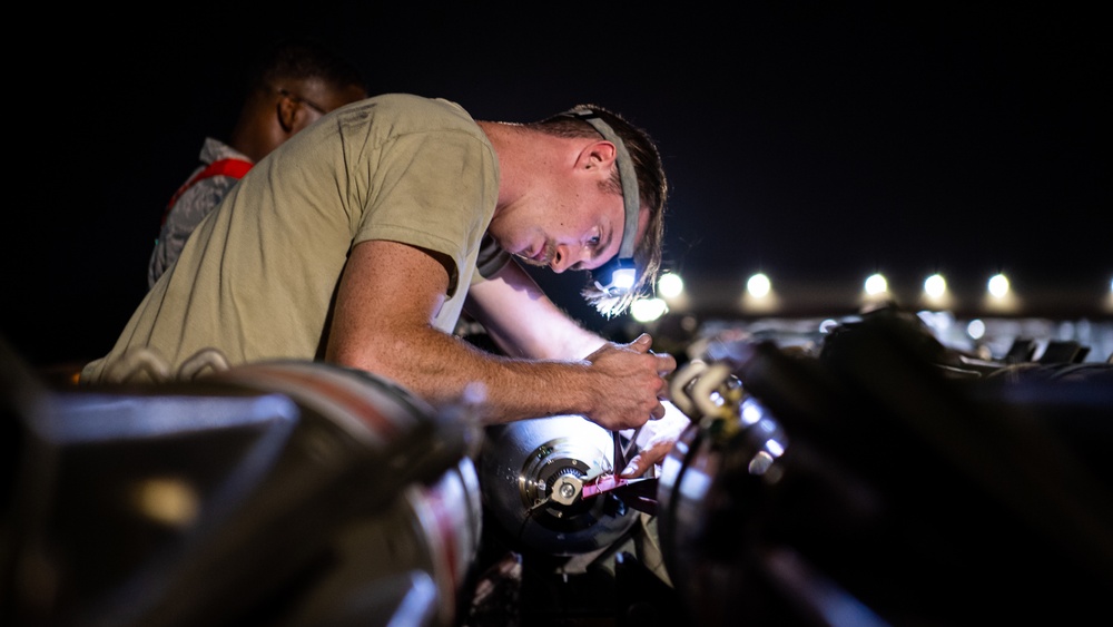 96th AMU Airmen load Navy mines as part of training exercise