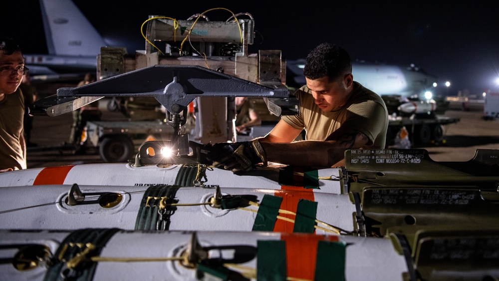 96th AMU Airmen load Navy mines as part of training exercise