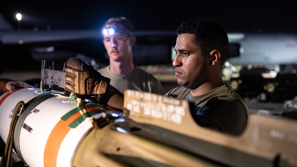 96th AMU Airmen load Navy mines as part of training exercise