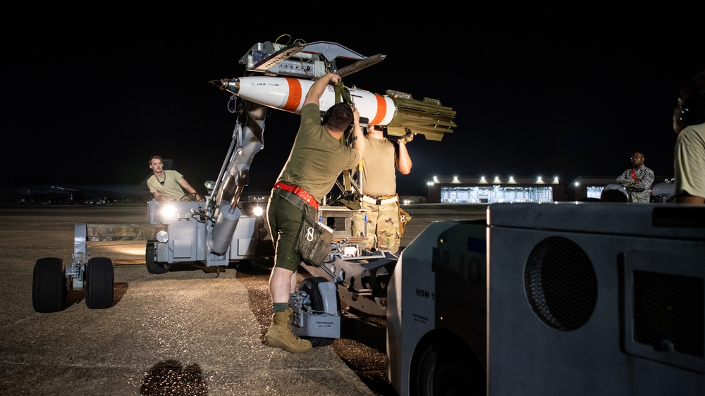 96th AMU Airmen load Navy mines as part of training exercise