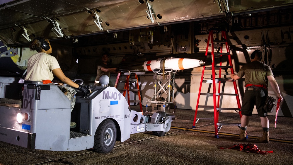 96th AMU Airmen load Navy mines as part of training exercise