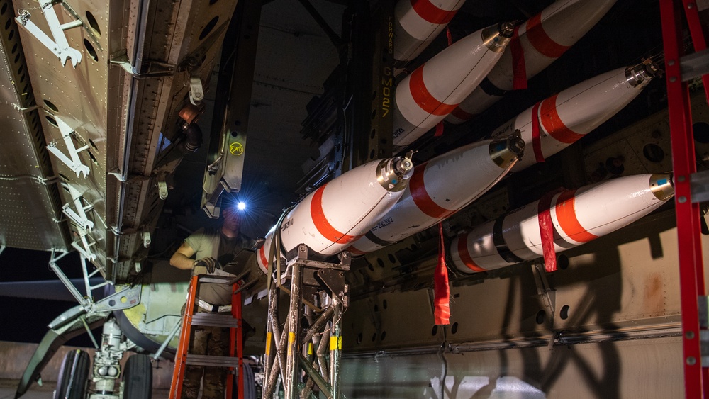 96th AMU Airmen load Navy mines as part of training exercise