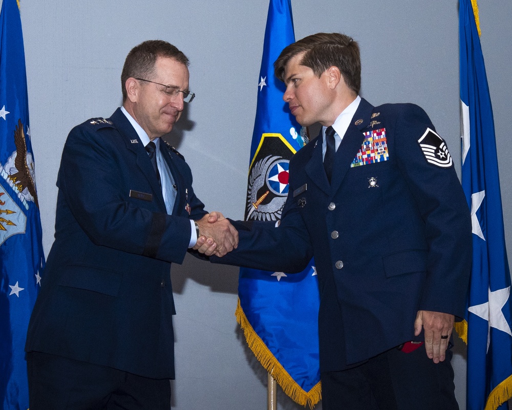 U.S. Air Force Lt. Gen. Jim Slife presents Silver Star Medal to Master Sgt. John Grimesey