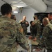 Col. Miner Reviews Plans on a Sand Table