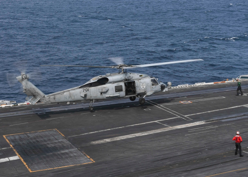 Helicopter Lands On Flight Deck