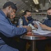 Aviation Ordnancemen Study For Air Warfare Exam In Library Aboard Aircraft Carrier USS Nimitz CVN 68