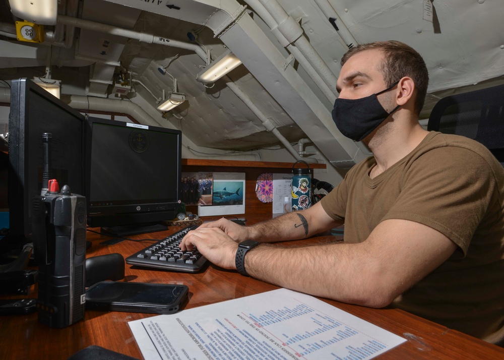 Aviation Boatswain's Mate (Handling) Mans Library Front Desk Aboard Aircraft Carrier USS Nimitz CVN 68