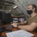 Aviation Boatswain's Mate (Handling) Mans Library Front Desk Aboard Aircraft Carrier USS Nimitz CVN 68