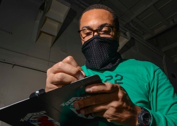 Material Control Officer Conducts Hangar Bay Walkthrough In Hangar Bay Aboard Aircraft Carrier USS Nimitz CVN 68