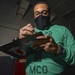 Material Control Officer Conducts Hangar Bay Walkthrough In Hangar Bay Aboard Aircraft Carrier USS Nimitz CVN 68