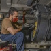 Aviation Ordnanceman Troubleshoots Binding Of 20MM Drum Aboard Aircraft Carrier USS Nimitz CVN 68