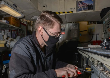 Aviation Electronics Technician Works On E2C Radar Aboard Aircraft Carrier USS Nimitz CVN 68