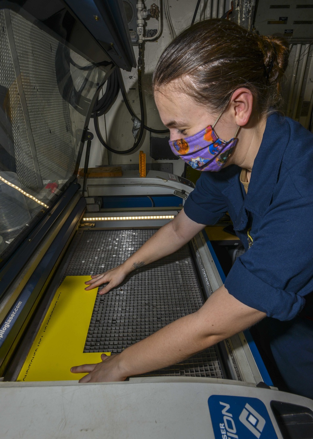 Machinery Repairman Engraves Signs With Laser Engraver Aboard Aircraft Carrier USS Nimitz CVN 68