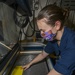 Machinery Repairman Engraves Signs With Laser Engraver Aboard Aircraft Carrier USS Nimitz CVN 68
