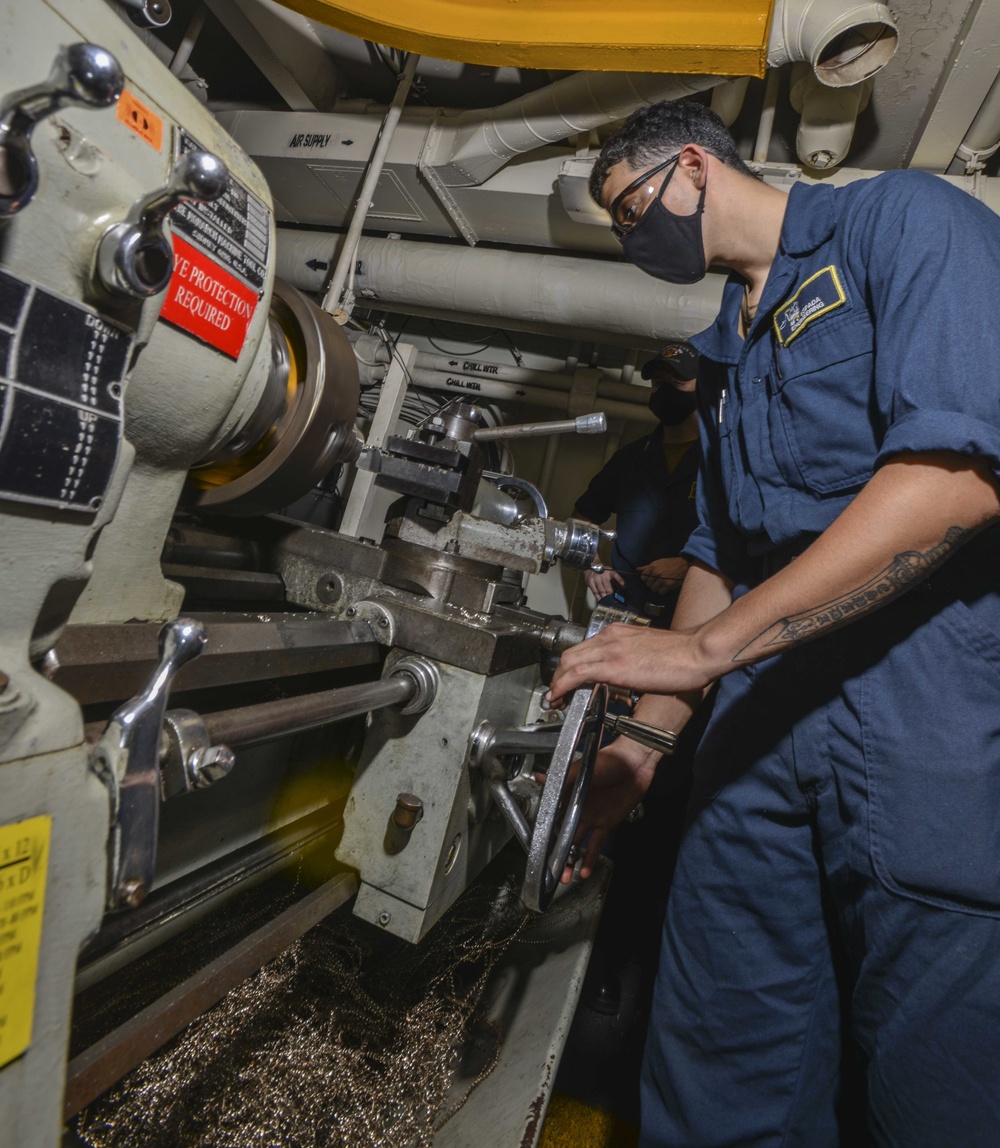 Machinery Repairman Operates Lathe Aboard Aircraft Carrier USS Nimitz CVN 68