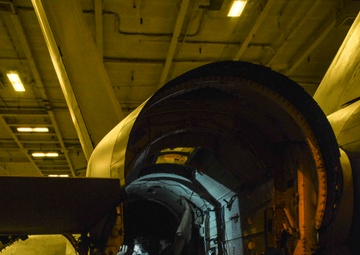 Aviation Structural Mechanics Perform Engine Bay Maintenance In Hangar Bay Aboard USS Nimitz CVN 68