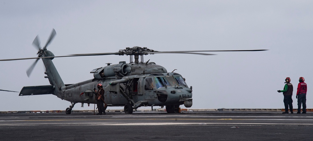 Sailors Perform Pre-Flight Checks On An MH-60S Sea Hawk Aboard Nimitz