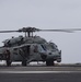 Sailors Perform Pre-Flight Checks On An MH-60S Sea Hawk Aboard Nimitz