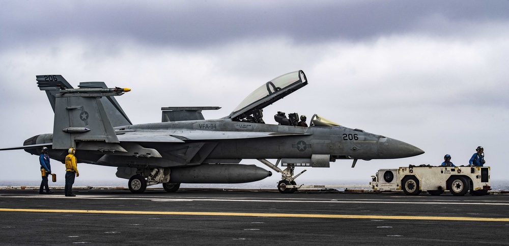 Sailors Taxi An F/A-18E Super Hornet Across The Flight Deck Aboard Nimitz