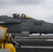 A Sailor Observes An F/A-18C Super Hornet Prepare To Launch Off Of The Flight Deck Aboard Nimitz