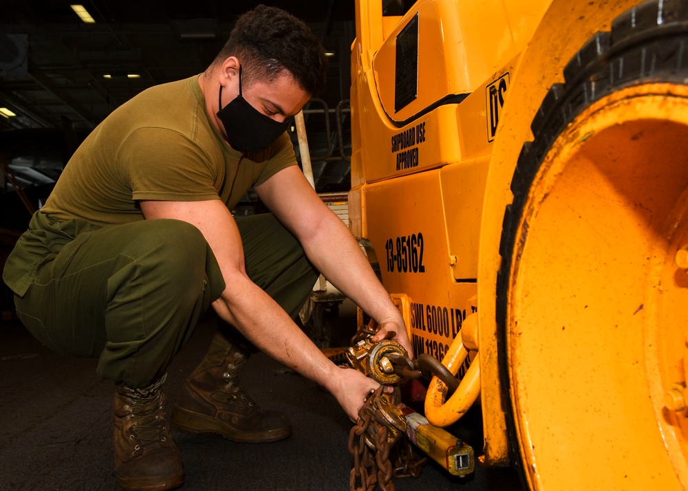 Marine Chocks and Chains Tractor In Hangar Bay