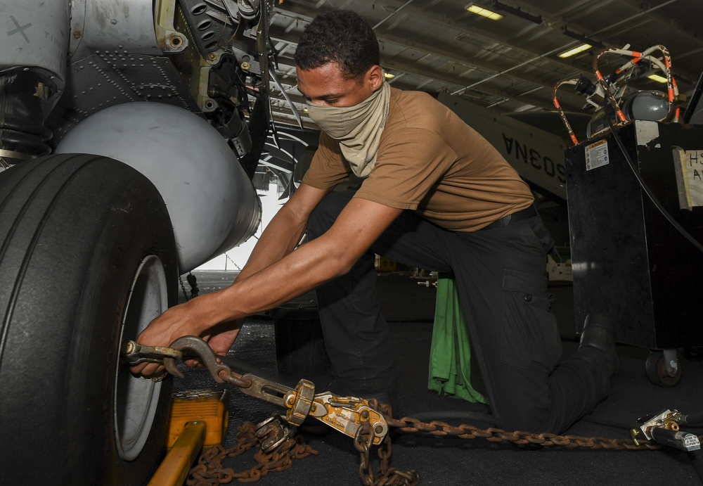 Sailor Inflates Tire On Helicopter