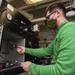 Sailor Tests Lower Hoses For Aircraft On Ports Machine
