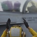 Aviation Boatswain's Mate (Handling) Signals To Pilot On Flight Deck Aboard Aircraft Carrier USS Nimitz CVN 68