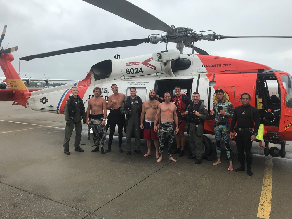 Coast Guard rescues 6 from overturned vessel after mariner activates emergency beacon