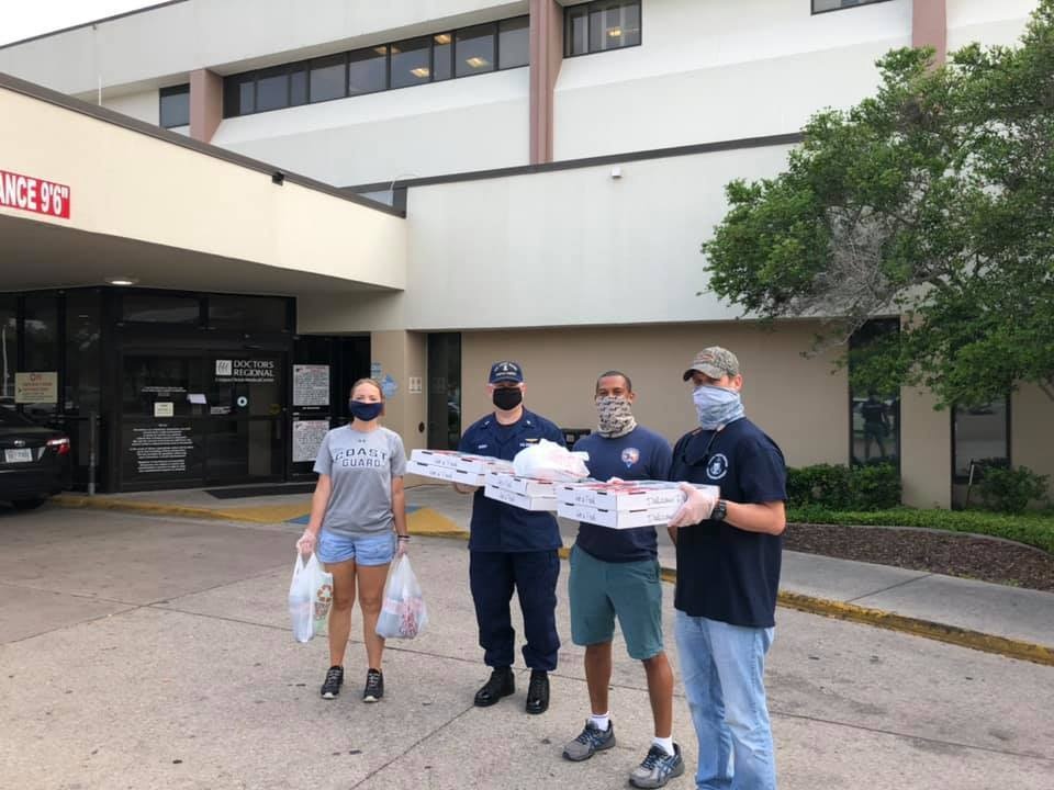 Coast Guard Sector/Air Station Corpus Christi crew members deliver dinners to Corpus Christi Medical Center personnel