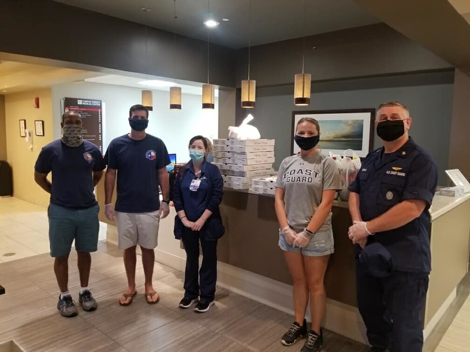 Coast Guard Sector/Air Station Corpus Christi crew members deliver dinners to Corpus Christi Medical Center personnel