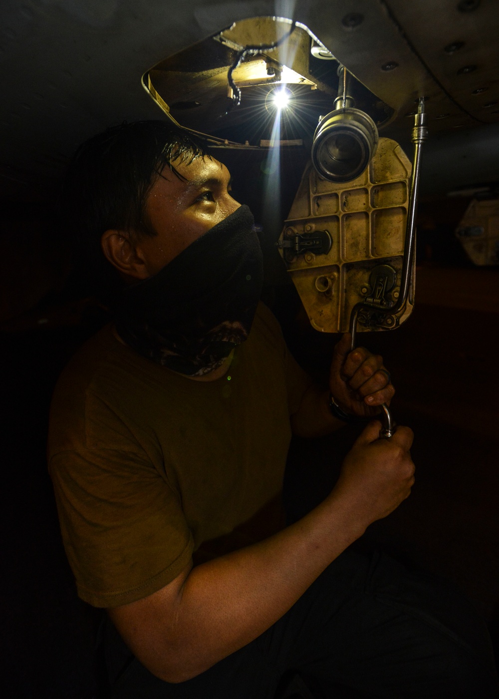 Aviation Machinist's Mate Replaces Ground Wire On An F/A-18E Super Hornet, From The &quot;Mighty Shrikes&quot; Of Strike Fighter Squadron (VFA) 94