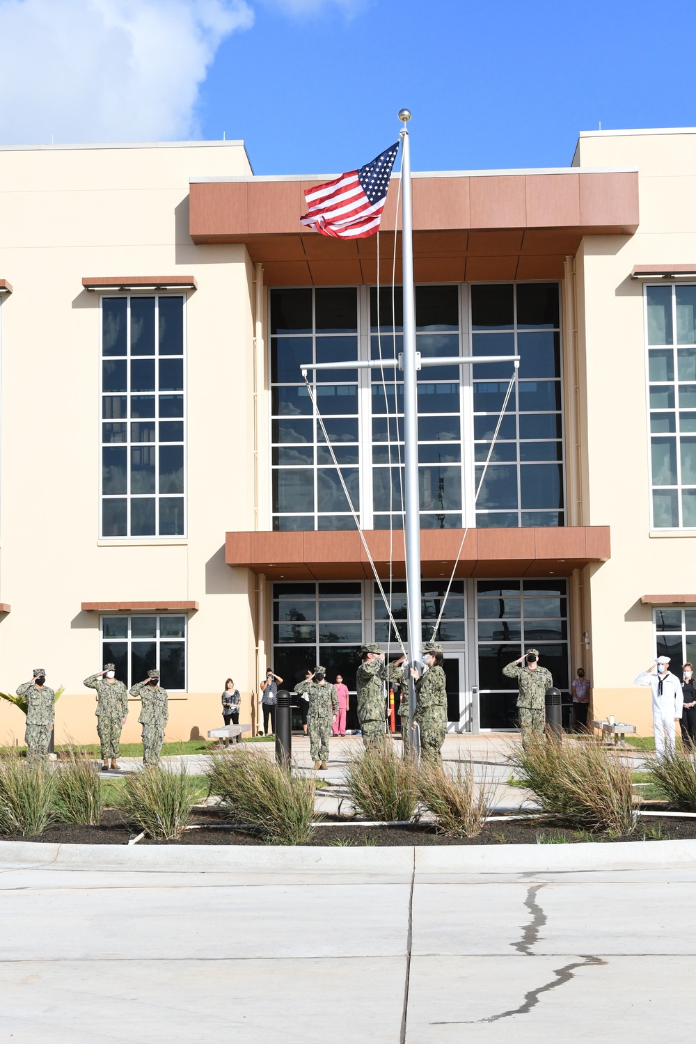 Sailors salute flag raised for the first time at new BHC Kaneohe Bay facility